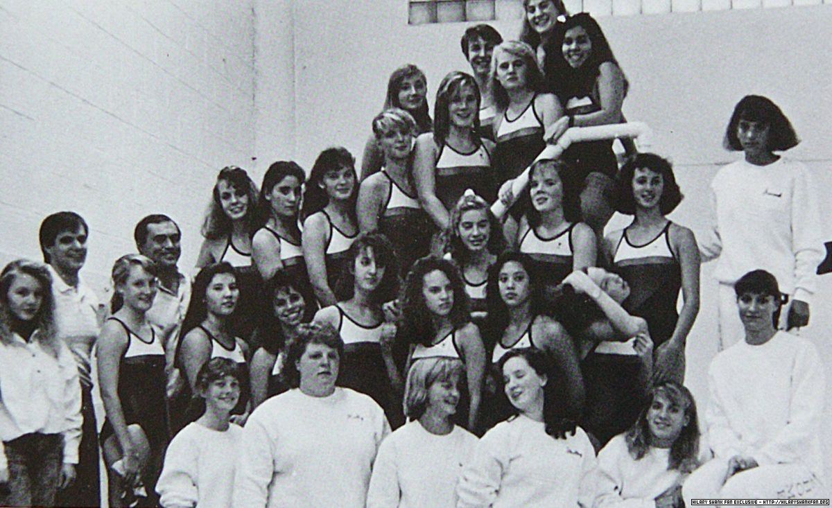 At age 14 in her highschool swimming team.
