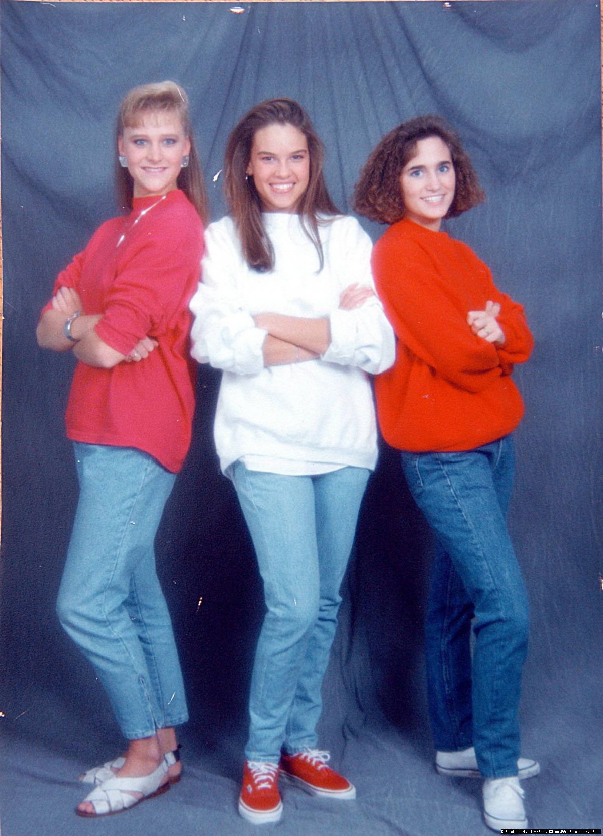 At age 17 with her high school friends Heather and Kristin posing for a photo.
